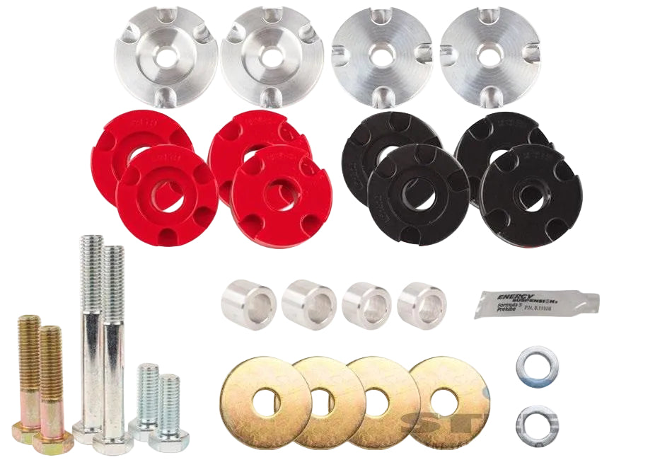Steeda Mustang Differential bush metal and urethane hardware components, including silver aluminium, and red and black urethane bushes , silver bolts, washers, nuts, and lube, arranged on a plain white background.