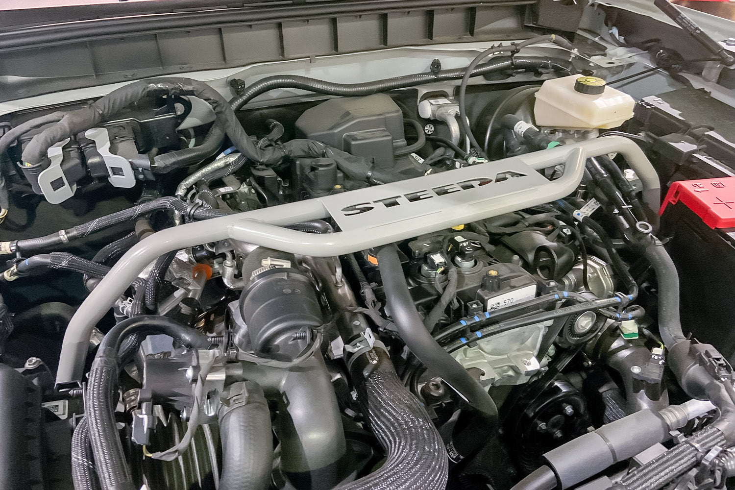 Steeda Strut Tower Brace for Ford Bronco 2021, 2022, 2023 installed in engine bay close up